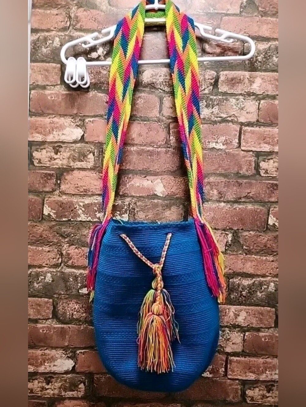 Woven Blue Bucket Bag with Vibrant Colorful Strap and Tassels